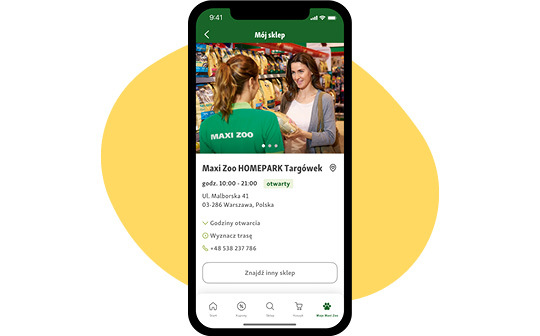 Ekran smartfona pokazujący informacje o sklepie Maxi Zoo HOMEPARK Targówek z godzinami otwarcia, adresem i kontaktem w sklepie zoologicznym w Warszawie, Polska.