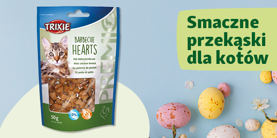 Trixie Barbecue Hearts smaczne przekąski dla kotów z piersią kurczaka, opakowanie 50g obok kolorowych pisanek i napisu 'Smaczne przekąski dla kotów'