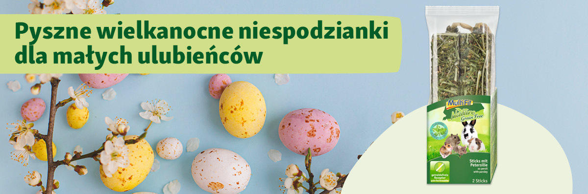 Kolorowe pisanki i kwitnące gałązki obok smakołyków MultiFit Nature Grain Free z pietruszką dla małych zwierząt, idealna wielkanocna niespodzianka.