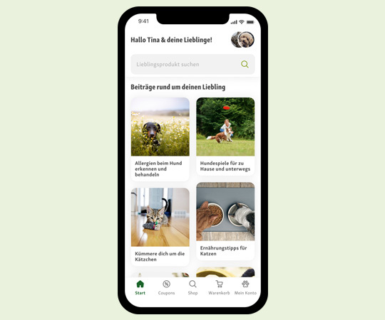 Smartphone-Bildschirm mit Haustierpflege-App, die Artikel zu Allergien bei Hunden, Hundespielen, Katzenpflege und Ernährungstipps zeigt.