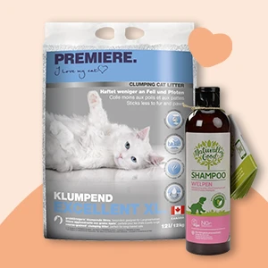 Premiere klumpende Katzenstreu XL mit weißer Katze und Natural Care Welpen-Shampoo mit Bürste auf hellem Hintergrund