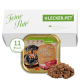 Hundfutterverpackung mit einem lächelnden Rottweiler, beschriftet mit "Gino's Feine Paté, Reich an Rind," mit 11 Portionen angegeben.