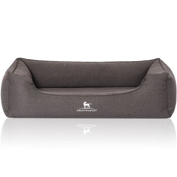 Graues Hundebett mit erhöhten Seiten und einem weichen Kissen, mit dem Logo 'KNUFFELWUFF' auf der Vorderseite.