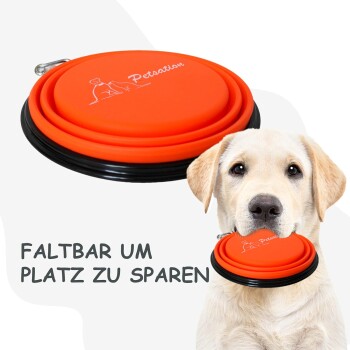 Orangenes zusammenklappbares Haustierfrisbee mit schwarzem Rand, mit dem Text 'FALTBAR UM PLATZ ZU SPAREN' neben einem Hundekopf.