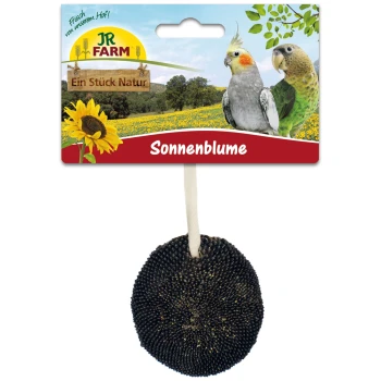 Ein sonnenblumenförmiger Vogelsnack von JR FARM, mit einem schwarzen Samendesign, mit einer Aufhängeschnur und einem bunten Hintergrund von Vögeln und Sonnenblumen.