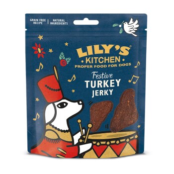Lily's Kitchen Festive Turkey Jerky für Hunde, mit einer verspielten Hundillustration und musikalischen Noten auf einem blauen Hintergrund.