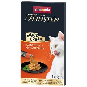 Weiße Katze, die sich die Lippen leckt, neben einer Tube Animonda Vom Feinsten Snack Cream mit Leberpastete und Garten Gemüse, 6 x 15g.