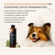 Hund mit Shampoo-Schaum auf dem Kopf neben einer Flasche The Animal Organics Conditioner mit deutschem Text, der Produktvorteile beschreibt.