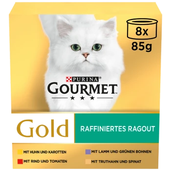 Die Verpackung von Purina Gourmet Gold Katzenfutter zeigt eine flauschige weiße Katze und Geschmäcker: Huhn & Karotten, Rind & Tomaten, Lamm & grüne Bohnen, Pute & Spinat.