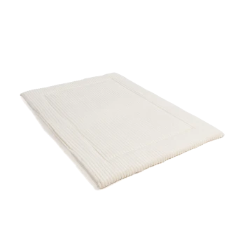 Ein weiches, cremefarbenes Haustierbett mit gerippter Textur und einem umrandeten Design, geeignet für Hunde oder Katzen.
