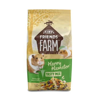 Tiny Friends Farm Harry Hamster Tasty Mix pet food bag with hamster images and 700g weight.