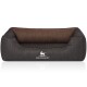Ein stilvolles Hundebett mit einem dunkelgrauen Äußeren mit gerippter Textur und einem weichen braunen Innenraum, markiert mit "KNUFFELWUFF."
