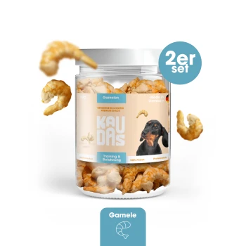 Ein Glas mit Garnelen-Hundeleckerlis, beschriftet mit 'KAUDAS' und einem Dackelbild, mit dem Text 'Training & Belohnung', '100% Fleisch' und 'Hergestellt in Deutschland.'