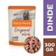 Nourriture pour chiens Nature's Variety Original Pâté, 300g, avec un chien souriant sur l'emballage, étiqueté "Sans céréales" et "Dinde."