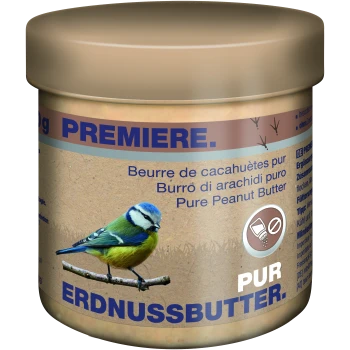 Jar of pure peanut butter with a blue tit on a branch and multilingual text, including "Pure Peanut Butter" and "Erdnussbutter."