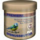 Jar of pure peanut butter with a blue tit on a branch and multilingual text, including "Pure Peanut Butter" and "Erdnussbutter."
