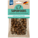 Hundefutterverpackung mit kleinen braunen Krokettenstücken, beschriftet mit 'SUPERFOODS' und 'Leinsaat & Petersilie,' und gekennzeichnet mit 'Hergestellt in Deutschland.'