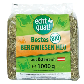 Bio-Alpenwiesenheu in einer 1000g-Packung, beschriftet mit "echt guat!" mit Schmetterlingen und Text auf Deutsch.