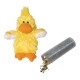 Yellow fluffy plush duck pet toy with orange beak and feet beside a clear tube spilling dried herbs.
