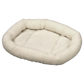 Lit pour animaux de compagnie blanc et moelleux avec une forme ovale et des bords surélevés, conçu pour les petits chiens ou chats.