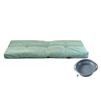 Ein plüschiges, türkisfarbenes Haustierbett mit gepolstertem Design neben einer grauen Futterschüssel, ideal für Komfort und Fütterung.