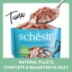 Schesir tuna natural fillets pet food in jelly with added vitamins, shown in a blue pouch with a spoonful of tuna.