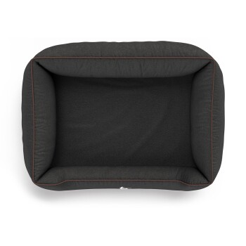 Eine Draufsicht auf ein dunkelgraues Haustierbett mit einem weichen, gepolsterten Innenraum und kontrastierenden braunen Kanten.