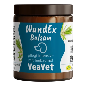 Braunes Glas mit VeaVet WundEx Balsam und blauem Etikett, Hundeikone, Text 'pflegt intensiv – mit Teebaumöl' und Teebaumblättern.