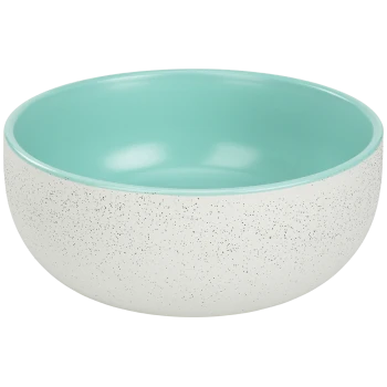Eine hellfarbige Haustierfutterschüssel mit einer gesprenkelten weißen Außenseite und einem glatten türkisfarbenen Inneren, die ein modernes Design zeigt.