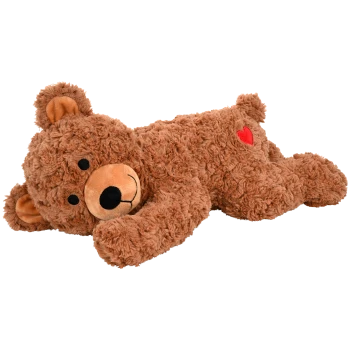 Ein plüschiger brauner Teddybär-Spielzeug mit einem lächelnden Gesicht, auf dem Bauch liegend, mit einem roten Herzen an der Seite.