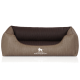 Ein plüschiges Hundebett in einem beige-braunen Farbschema, mit einem gesteppten Design und dem Logo "KNUFFELWUFF" deutlich sichtbar.