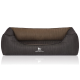 Ein stilvolles Hundebett in Dunkelgrau mit einem gerippten Design und einem weichen braunen Innenraum, mit dem Logo "KNUFFELWUFFF" auf der Vorderseite.