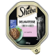 Nourriture pour chats Sheba Delikatesse en gelée avec du saumon, présentant un chat gris sur l'étiquette, 85g, et une certification pour des fruits de mer durables.