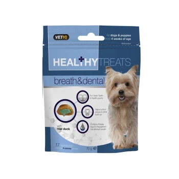 Packaging for VETIQ Healthy Treats Breath & Dental for dogs and puppies, featuring a smiling dog, with details on ingredients and benefits.
