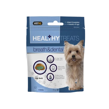 Packaging for VETIQ Healthy Treats Breath & Dental for dogs and puppies, featuring a smiling dog, with details on ingredients and benefits.
