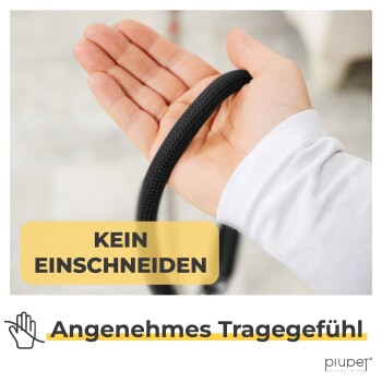 Eine Hand hält eine schwarze Hundeleine, mit Textüberlagerung, die "KEIN EINSCHNEIDEN" und "Angenehmes Tragegefühl" besagt, um Komfort zu fördern.