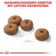Vier braune, donutsförmige Haustierfutterkibble auf einem hellen Hintergrund, mit dem Text "MASSGESCHNEIDERTE REZEPTUR MIT AKTIVEN NÄHRSTOFFEN" darüber.