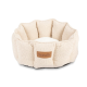 Ein gemütliches beiges Haustierbett mit einem plüschigen, runden Design und einem weichen weißen Kissen in der Mitte, mit einem Lederlabel von Scruffs®.