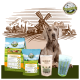 Ein Weimaraner sitzt vor Bellfor-Haustierfutterprodukten, darunter "SHIMUN SKIN" und "Fleischfutter", mit einer Windmühle im Hintergrund.