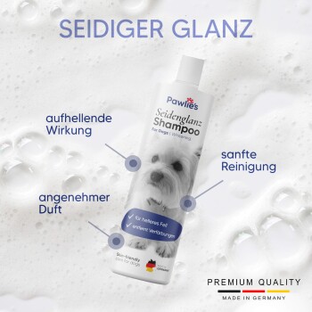 Flasche Pawlie's Seidenglanz Shampoo für Hunde, mit einem Bild eines weißen Hundes, mit Text, der Aufhellung, sanfte Reinigung und angenehmen Duft hervorhebt.
