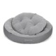 Graues rundes Haustierbett mit plüschigem, gepolstertem Design, mit dem Logo "Doctor Bark" an der Seite.