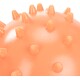 Close-up of a spiky orange dog toy, featuring a glossy finish and multiple pointed protrusions for added texture and engagement.