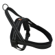 Black dog harness with reflective stitching and a metal D-ring for leash attachment, designed for comfort and safety.