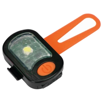Een kleine zwarte en oranje LED huisdierveiligheidslamp met een diamantpatroon lens en een oranje band voor bevestiging.