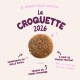 Croquette ronde pour animaux sous le titre 'La CROQUETTE 2026' avec l'étiquette française 'Disponibles en taille small'.