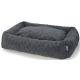 Un lit pour animaux en peluche gris avec un motif texturé et un intérieur doux et rembourré, idéal pour les chiens ou les chats.