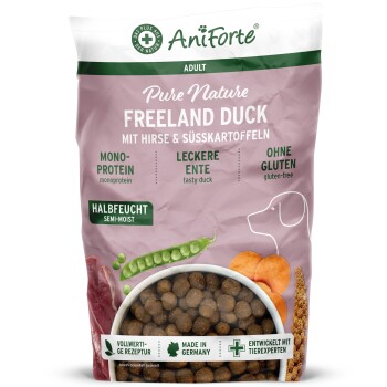 Eine Tüte AniForte PureNature FreelandDuck Hundefutter mit Bergkulisse, die Ente, Hirse, Süßkartoffel und Gemüse zeigt.