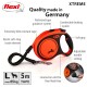 Flexi XTREME dog leash in orange, featuring a soft grip handle, adjustable settings, and a 5m tape for dogs up to 65kg.