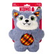 Gray plush wolf toy with white face, green eyes, fangs and orange plaid belly and ears on red backing labeled 'KONG'.