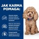 Uśmiechnięty pudel siedzi na niebieskim tle z tekstem o korzyściach karmy dla zwierząt dla zdrowia jelit i trawienia.